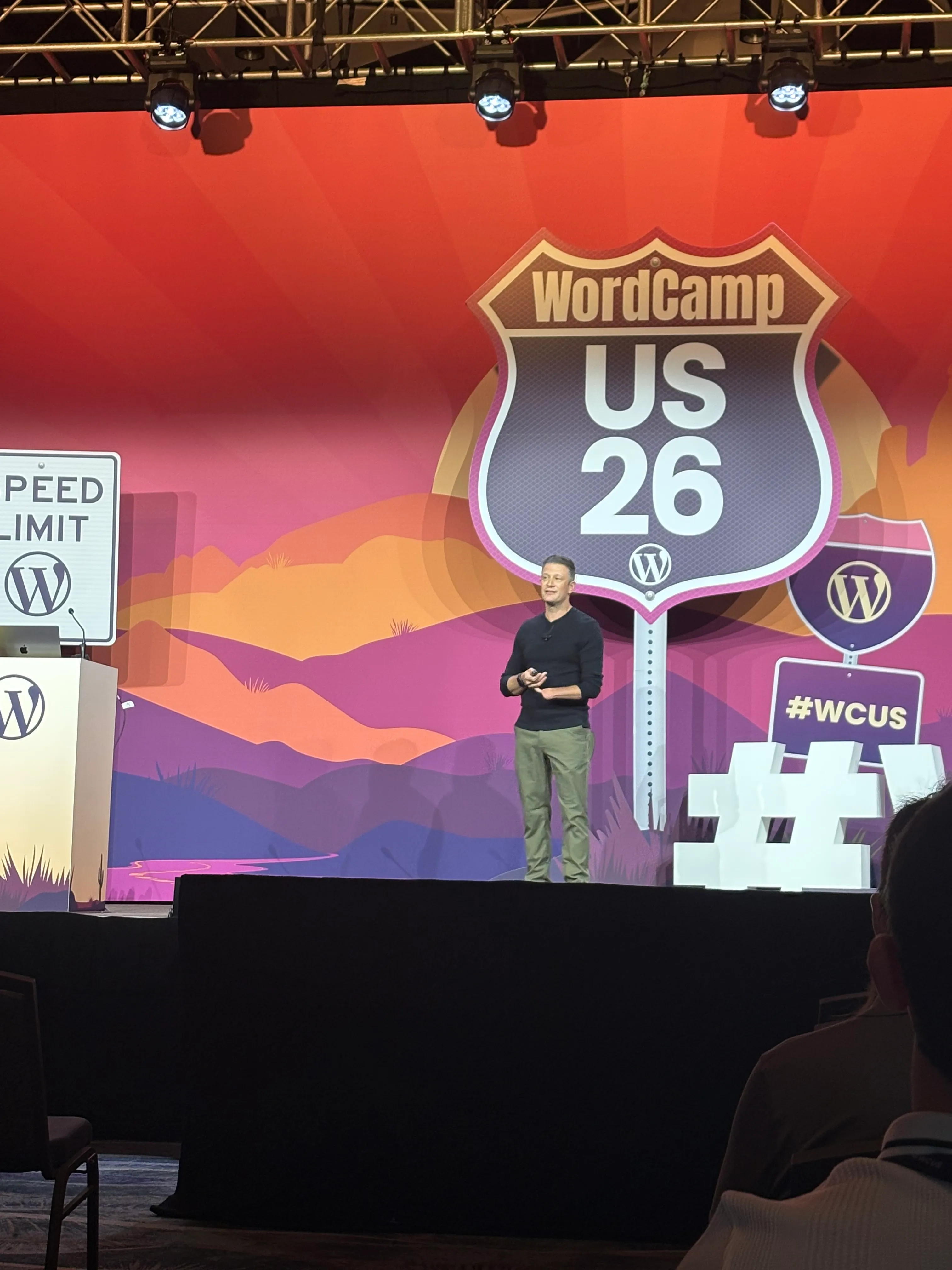 Loyal Pyczynski speaking on the WordCamp US 2026 main stage during the Dreaming with AI keynote.