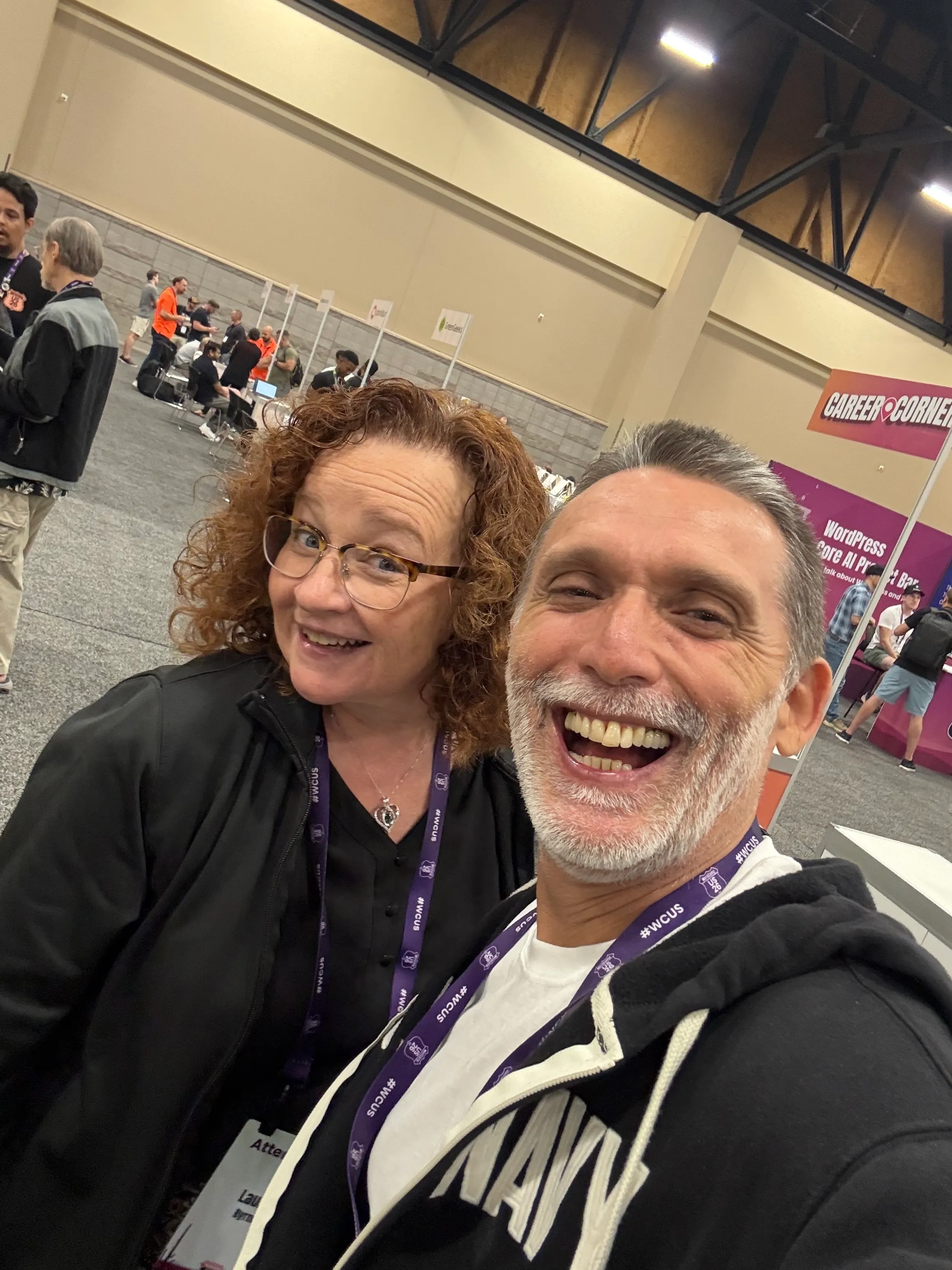 WebDevStudios coworkers Laura Byrne and Alfredo Navas smiling together at WordCamp US 2026.