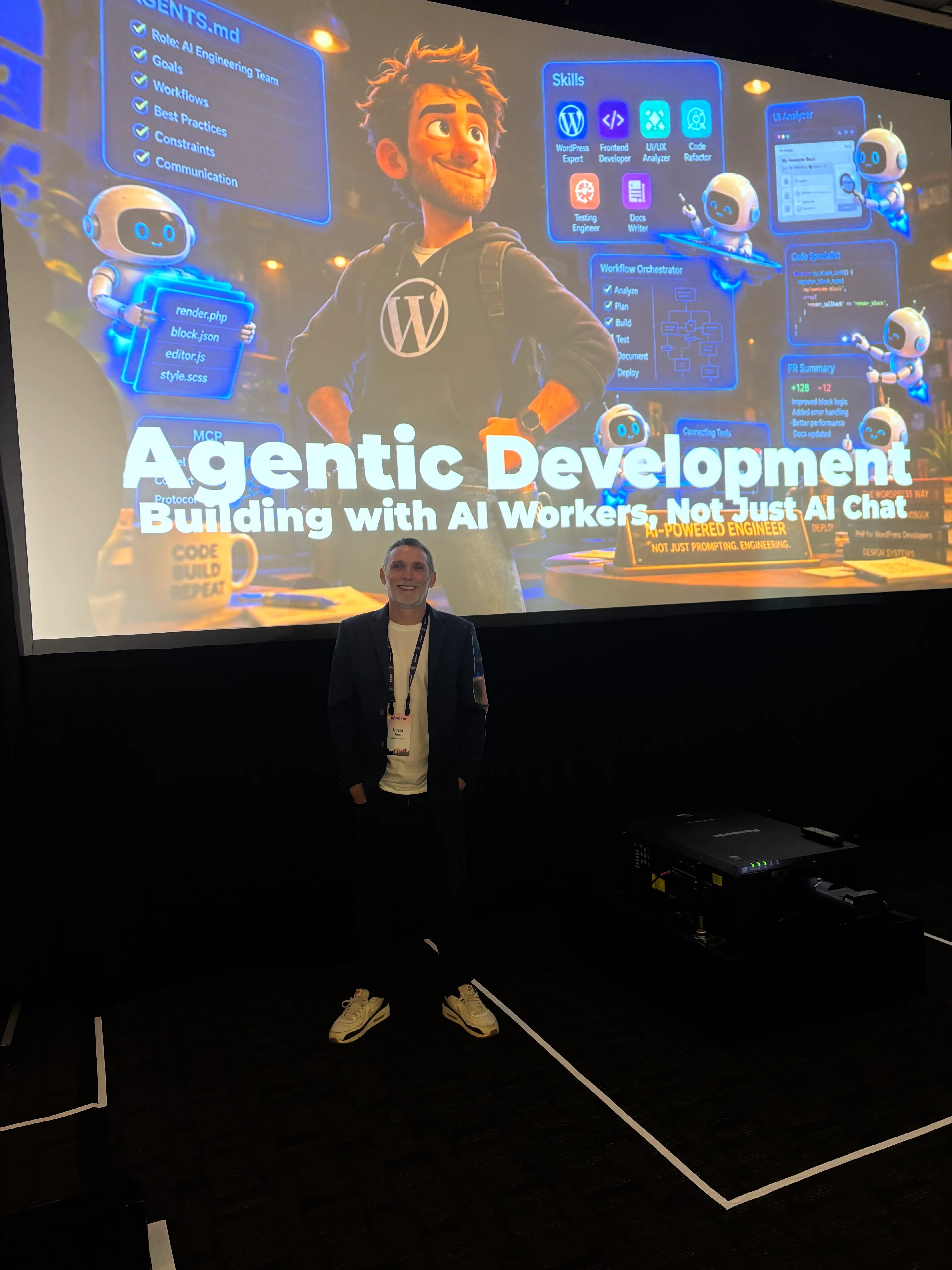 Alfredo Navas standing in front of the projected Agentic Development title slide at WordCamp US 2026.
